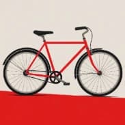 Una bicicleta roja sobre fondo crema